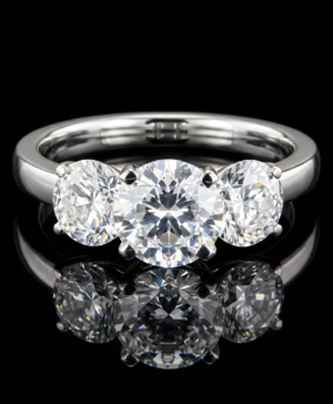 750/-White Claw Set Trilogy Ring 2 Carat Centre, 0.50ct each Side Stones TDW = 3.00ct D/E VVS-VS